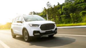 White suv sedan flying fast on the highway