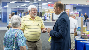 Senator Langerholc with two senior citizens