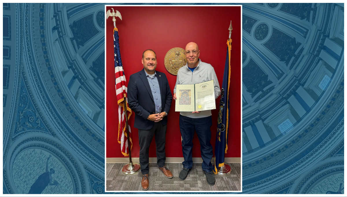 Photo of Senator Langerholc standing next to Fred Kline, who is holding Senate citation.